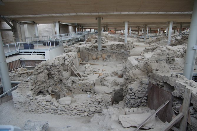 Archaeological Bus Tour To Akrotiri Excavations & Red Beach - The bus, guide, and pickup system