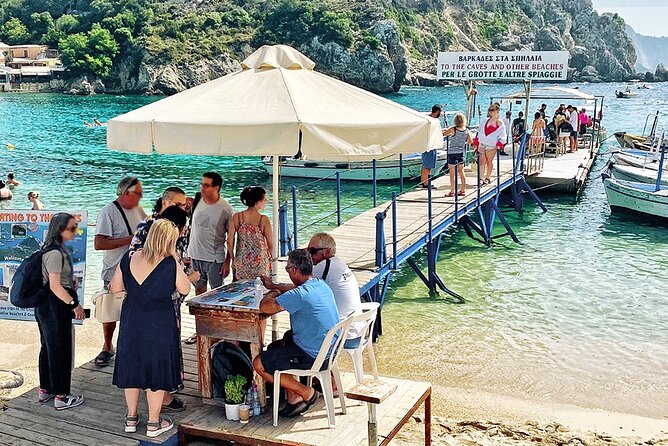 Bus Trip with Swim to Paleokastritsa and Olive Oil Museum - Traditional houses and a café in Makrades