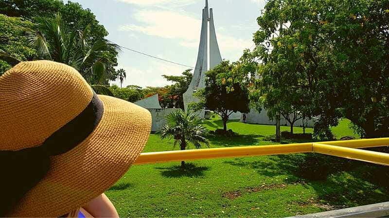 Cancun: Guided City Tour with Shopping by Double Decker Bus - Boulevard Kukulcan from a panoramic bus