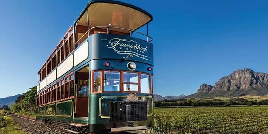 Cape Town: Franschhoek Wine Tram Hop-On Hop-Off Tour - Leaving Cape Town for the Franschhoek Valley