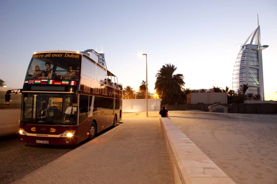 Dubai: Big Bus Panoramic Night Tour & Optional Dinner Cruise - Souk Madinat Jumeirah and the contrast with the towers