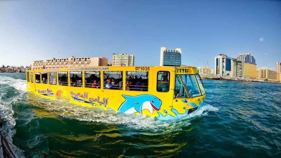 Dubai: Old town tour with Wonder Bus, souks, Creek and Guide - The guide, languages, and family appeal