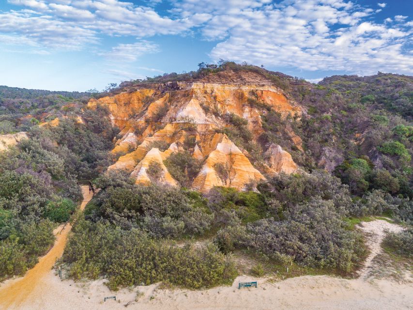 From Hervey Bay: K'gari, Fraser Island Two-Day Coach Tour - The Pinnacles and the story behind the sand