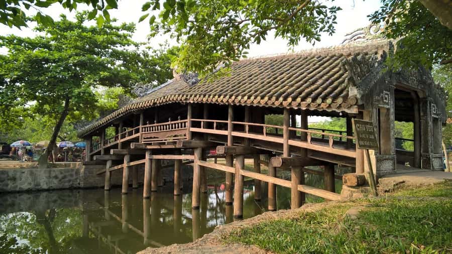 From Hue: Hoi An Guided Bus Tour with 4 Scenic Stops - The guide and group format