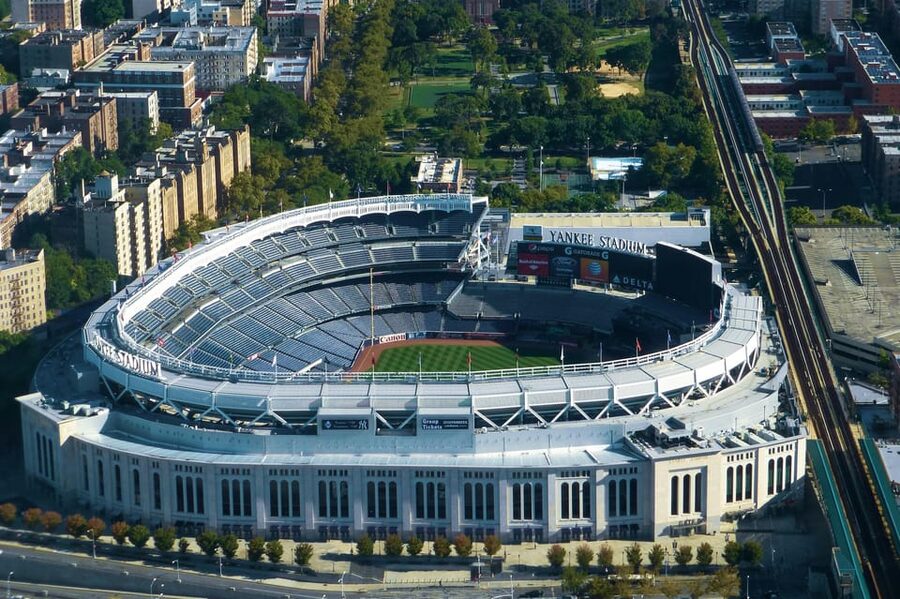 From Manhattan: 5-Hour Bronx, Queens, and Brooklyn Bus Tour - Starting near Times Square and crossing into Harlem
