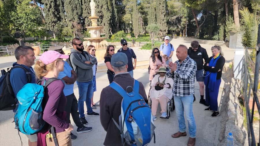 From Tel Aviv: Jericho, Jordan River, and Bethlehem Bus Tour - Crossing into Bethlehem and meeting your local guide