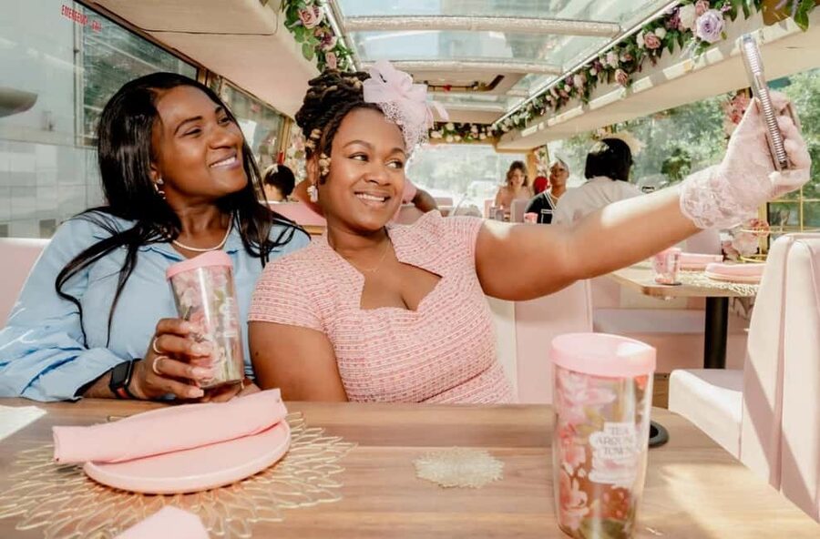 Houston: Tea Around Town® Afternoon Tea Bus Tour - A pink double-decker start across from City Hall