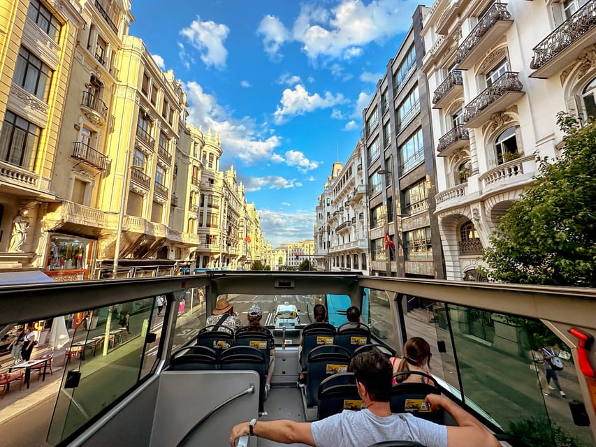 Madrid: Open-Top Big Bus Sightseeing Tour with Live Guide - Biblioteca Nacional, Atocha Station, and Madrid’s public face
