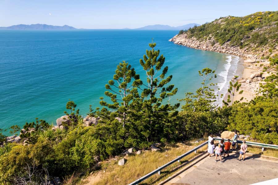 Magnetic Island: Guided Bus Tour with Morning Tea - Cockle Bay and Picnic Bay show two sides of the island