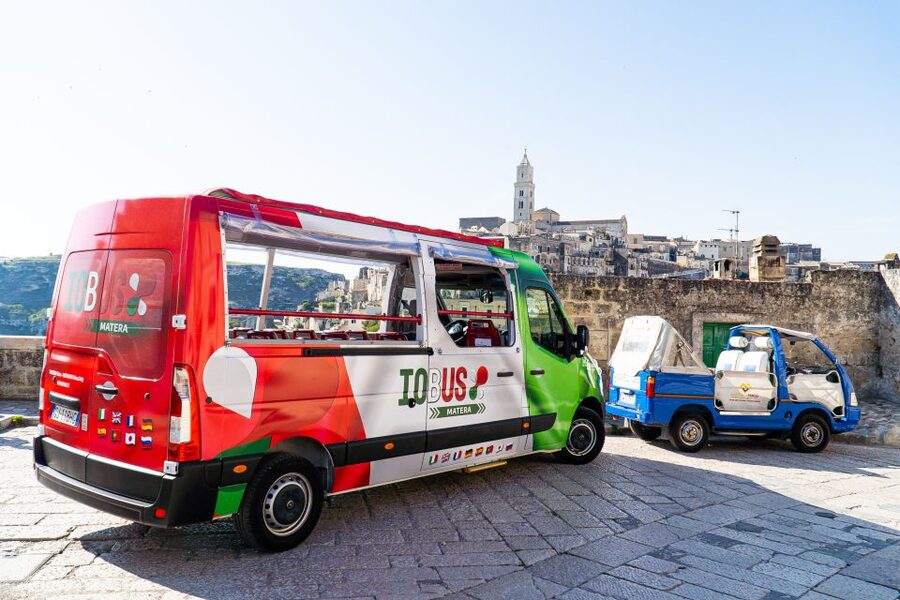 Matera: Open Top Bus Tour with Entrance to Casa Grotta - Piazza Vittorio Veneto reveals modern Matera