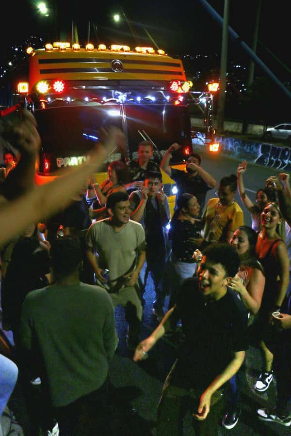 Medellin: Rumbero Party Bus with all the beer you can drink - Milla de Oro Avenue and Medellín after dark
