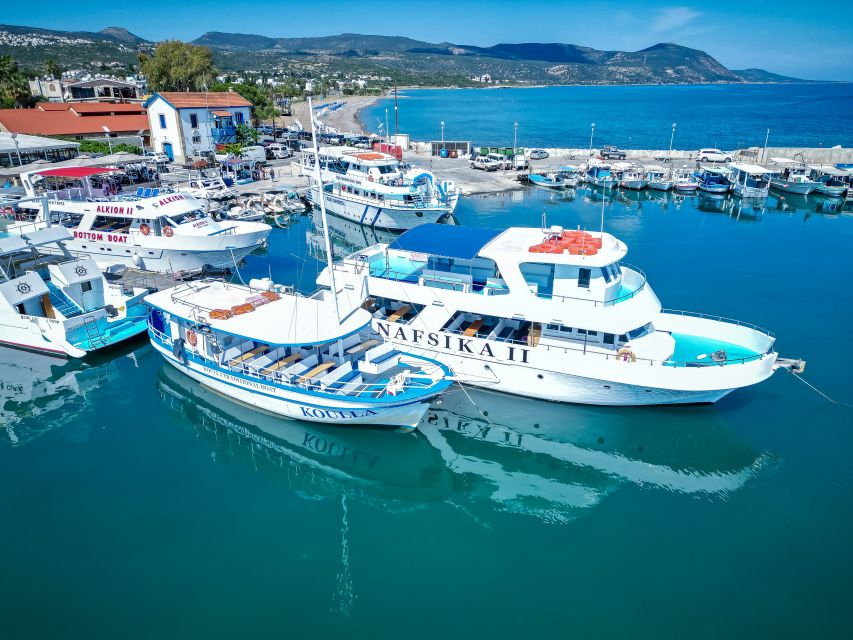 Paphos/Akamas: Blue Lagoon Bus & Boat Tour with Water Slide - Boarding the boat at Latchi