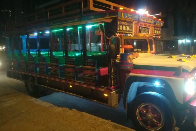Party Bus Tour - Passing the Clock Tower and San Felipe Castle