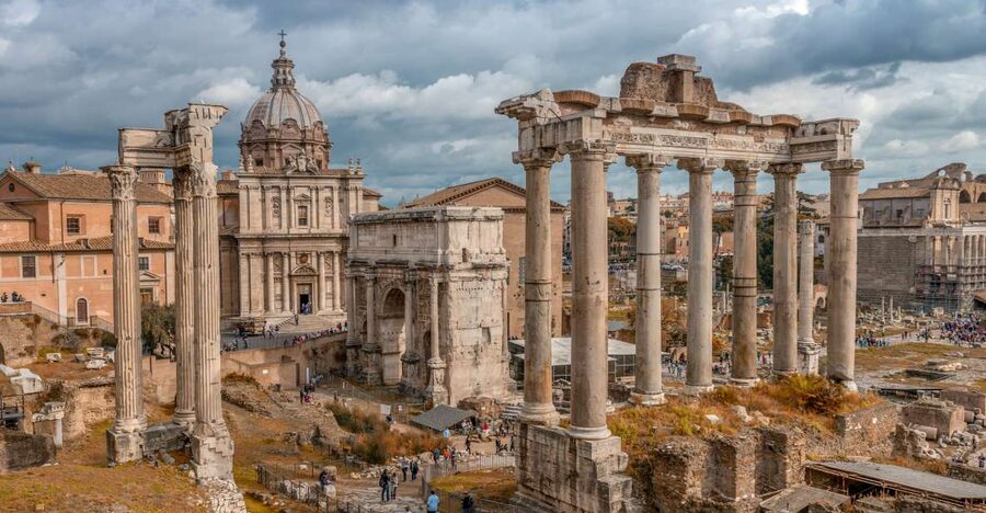 Rome: Colosseum Experience and Panoramic Bus Tour - Walking through the Roman Forum
