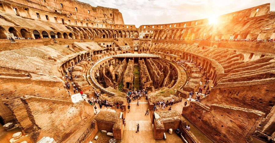 Rome: Hop-On Hop-Off Bus, Roman Forum & Colosseum Tour - Walking the Roman Forum along the Via Sacra