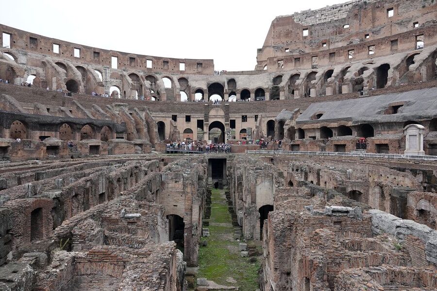 Rome: Hop-On Hop-Off Bus, Roman Forum & Colosseum Tour - Entering the Colosseum with a small group