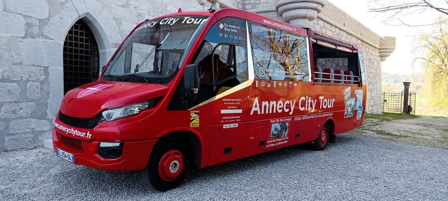 Tour of Annecy by convertible bus - Who will enjoy this ride most?