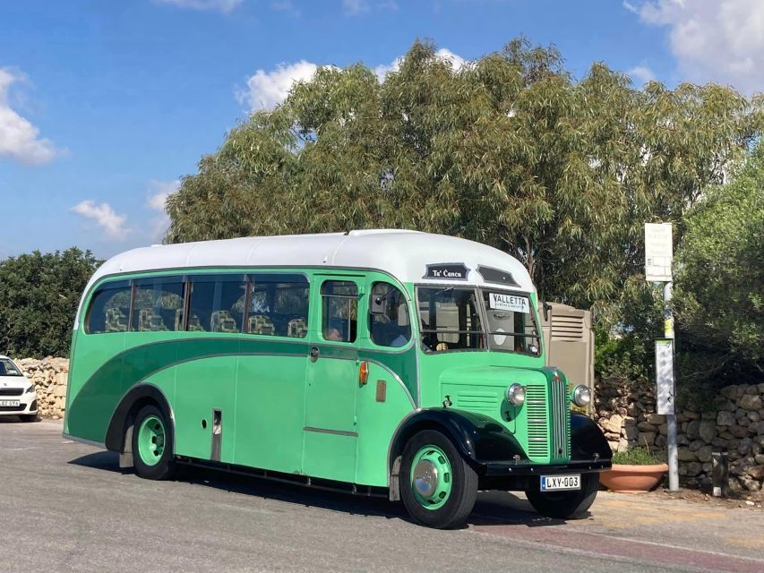 Valletta: Sunday Vintage Bus to Marsaxlokk - Leaving Valletta near Triton Fountain