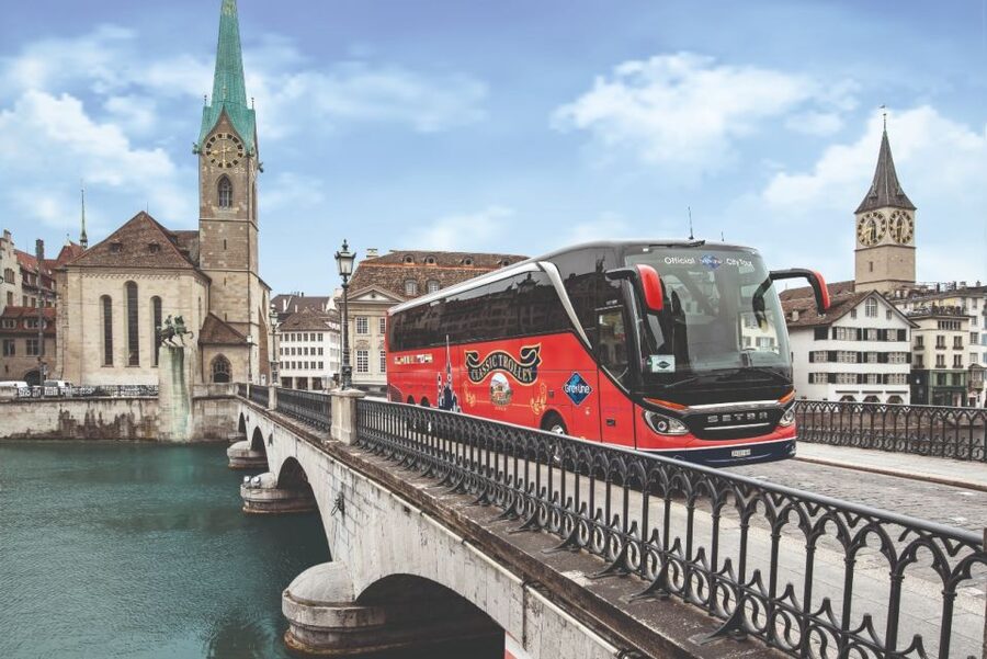 Zurich: City Bus Tour with Audio Guide and Lake Cruise - Cruising Lake Zurich past villas and mountains